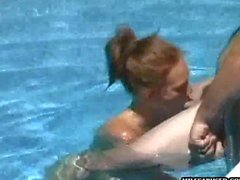 Milf gives blowjob on big hard cock outdoors in pool