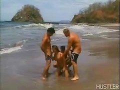 Rita gets three dicks on the beach