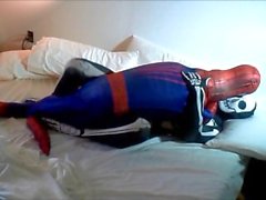 skeleton humps spiderman on his white bed