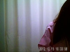 Dressing room spycam shots reveal a skinny brunette's small