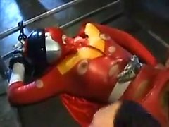 Nubile power ranger in a skintight orange suit takes a roug