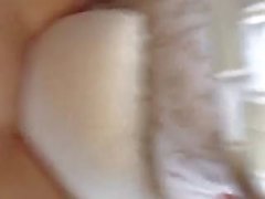 Grinding the pillow to make herself cum