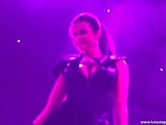 Busty MILF shows her amazing body on the stage