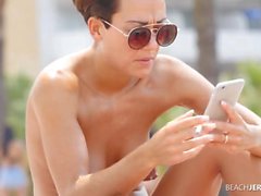 Pierced nipples spied on at the beach