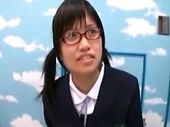 Lovely Oriental schoolgirl with glasses sucks and strokes a