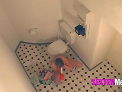 Hidden bathroom camera catches her masturbating