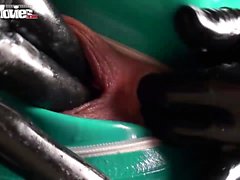 Two hot latex lesbians get covered in piss after finger