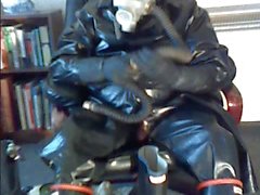 Wanking in rubber.