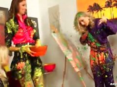 Clothed women make a mess with paint