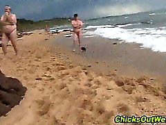 Naked girlfriend at the beach gets naked