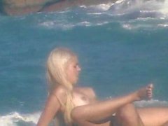 Amazing blonde banged beach-side