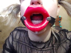 Russian girl fucks herself in the throat with a rubber dick