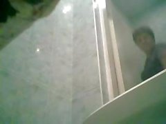 Hidden cam catches this girl sitting on the toilet to pee