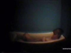 Busty mother masturbates in bath