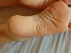 Cum shot on sexy soles of her feet