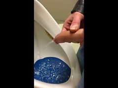 dirty boy pissing in dirty urinal