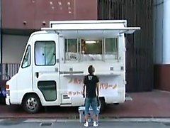 Cute food truck gal lets a customer come inside and toy her